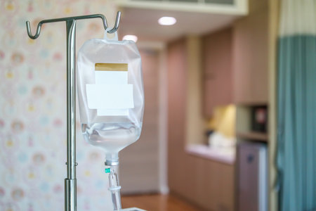 Close up medical intravenous IV drip in hospital backgroundの写真素材