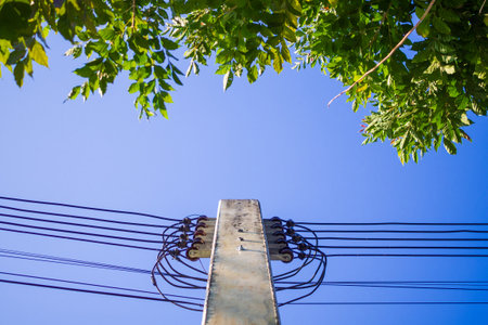 Electric power poles with power lines background