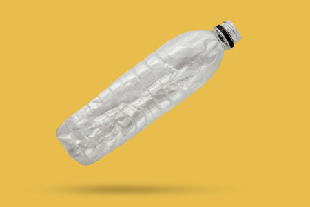 recycled plastic bottle isolated on yellow background