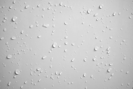 Water drops on white wall background textureの写真素材