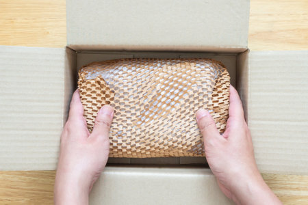 Eco friendly brown paper honeycomb wrap for product packaging parcel carton boxの写真素材