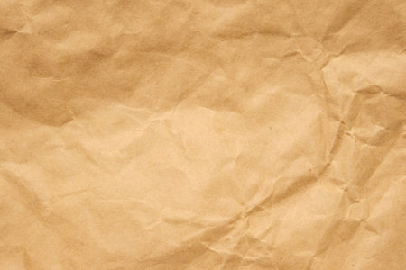 Abstract crumpled and creased recycle brown paper texture backgroundの写真素材