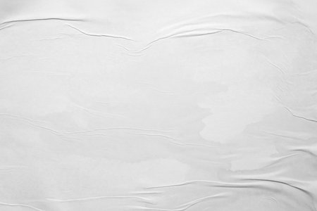 white crumpled and creased glued wrinkled paper poster texture backgroundの写真素材