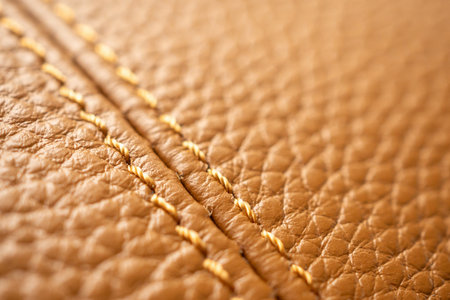 luxury brown leather bag texture background with stitching