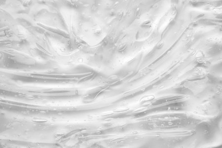 Transparent clear liquid serum gel cosmetic texture backgroundの写真素材
