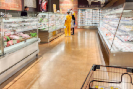 supermarket grocery store aisle and shelves blurred backgroundの写真素材