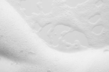 Abstract white soap foam bubbles texture on white background