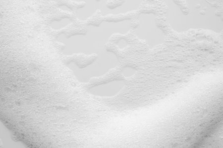 Abstract white soap foam bubbles texture on white background
