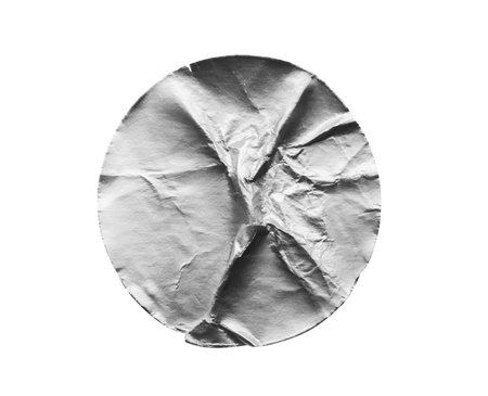 Blank silver round adhesive paper metallic sticker label isolated on white backgroundの写真素材