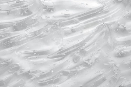 Transparent clear liquid serum gel cosmetic texture backgroundの写真素材