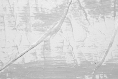 Gray color on white crumpled and creased paper poster texture backgroundの写真素材