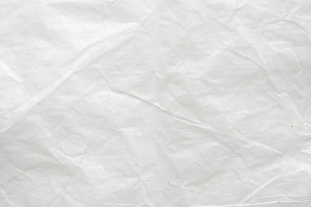 Abstract white crumpled and creased recycle paper texture backgroundの写真素材