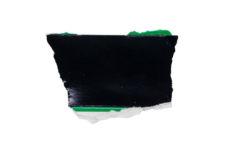piece of black paper tear isolated on white backgroundの写真素材
