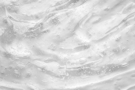 Transparent clear liquid serum gel cosmetic texture backgroundの写真素材