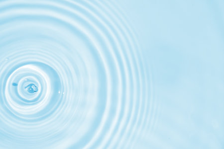 Abstract transparent water shadow surface texture natural ripple on blue backgroundの写真素材