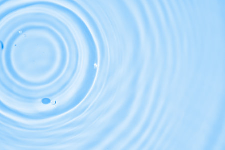 Abstract transparent water shadow surface texture natural ripple on blue backgroundの写真素材