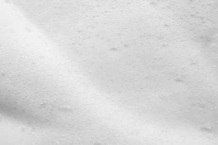 Abstract white soap foam bubbles texture backgroundの写真素材