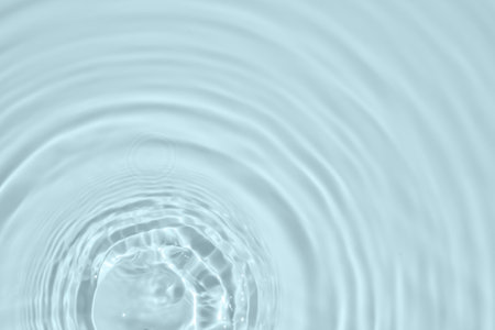 Abstract transparent water shadow surface texture natural ripple on blue backgroundの写真素材