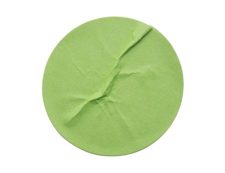 Blank green round adhesive paper sticker label isolated on white backgroundの写真素材
