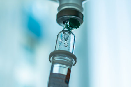 Close up medical intravenous IV drip in hospital backgroundの写真素材