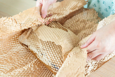 Eco friendly brown paper honeycomb wrap for product packaging parcel carton boxの写真素材