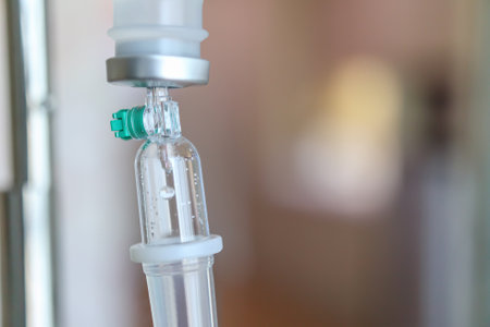 Close up medical intravenous IV drip in hospital backgroundの写真素材