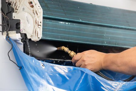 air conditioning cleaning service with water sprayの写真素材