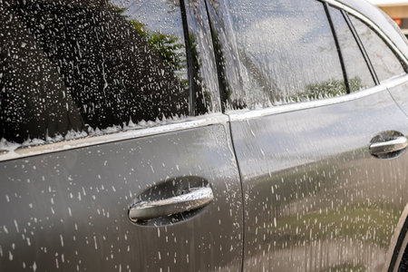 car cleaning and washing with foam soapの写真素材