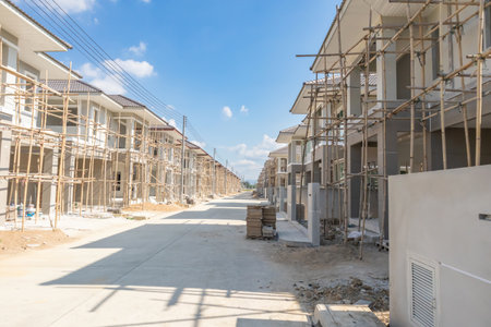 construction residential new house in progress at building site housing estate developmentの写真素材