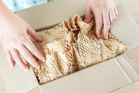 Eco friendly brown paper honeycomb wrap for product packaging parcel carton boxの写真素材