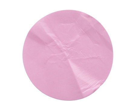 Blank pink round adhesive paper sticker label isolated on white backgroundの写真素材