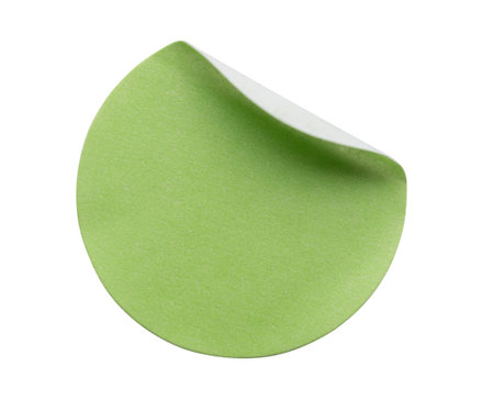 Blank green round adhesive paper sticker label isolated on white backgroundの写真素材