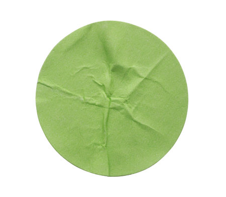Blank green round adhesive paper sticker label isolated on white backgroundの写真素材