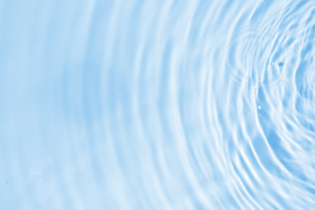 Abstract transparent water shadow surface texture natural ripple on blue backgroundの写真素材