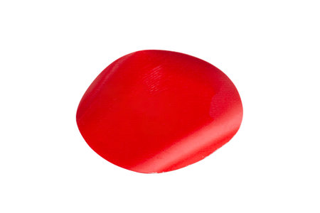 Red oval shape paper sticker isolated on white backgroundの写真素材