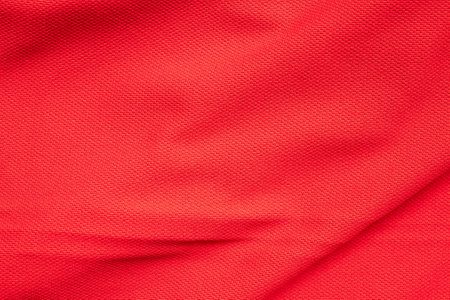 Red sports clothing fabric football jersey texture close upの写真素材