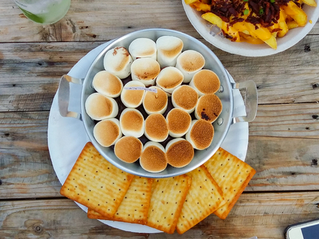 Smores with marshmellow,chocolate and cracker on wooden tableの写真素材