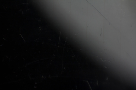 Scratched glass background surface. Black color textureの写真素材
