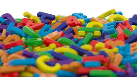 Alphabet letters on plain background. Plastic alphabet letters on white background. Rainbow colors....