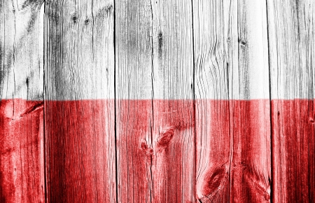 The Polish flag painted on wooden fenceの写真素材