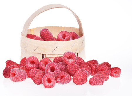 Very tasty summer raspberries in wooden basket