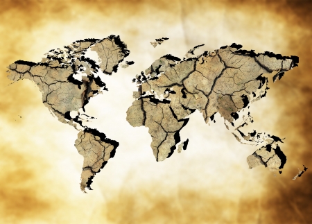 Map of the world with continents from dry deserted soil over old paper backgroundの写真素材