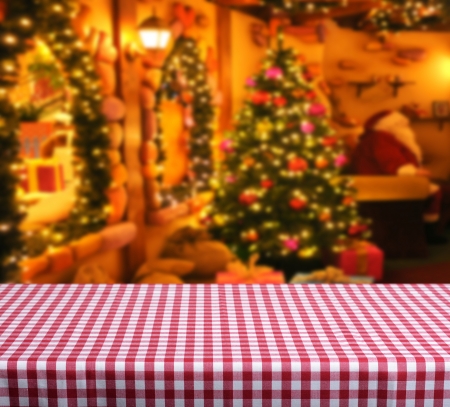 Empty wooden table for product display montages. Santa claus home in backgroundの写真素材