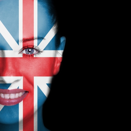 Woman face covered with flag of Great Britainの写真素材