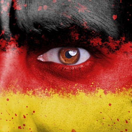 Germany flag painted on angry man faceの写真素材