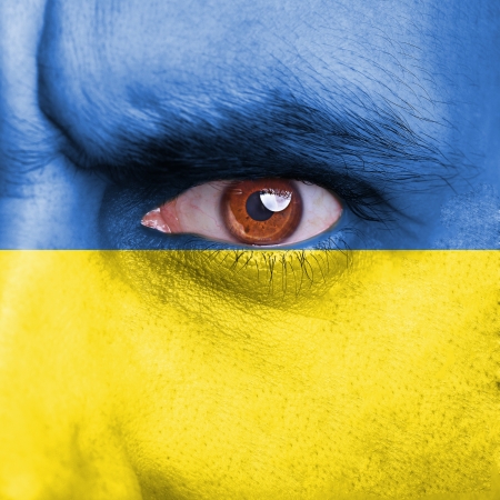 ukraine flag painted on faceの写真素材