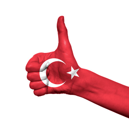 Turkey flag painted on hand over white backgroundの写真素材