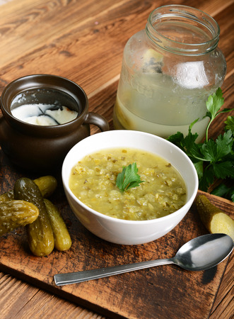 Tasty cucumber soup on wooden backgroundの写真素材