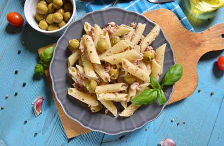 Pasta with tuna chunks and green olivesの写真素材