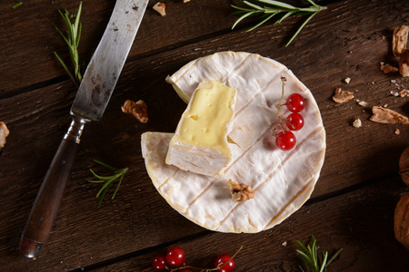 Camembert cheese on a rustic backgroundの写真素材